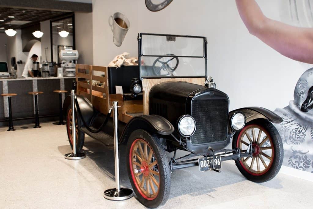 1920's themed coffee shop with Ford Model T and Mural