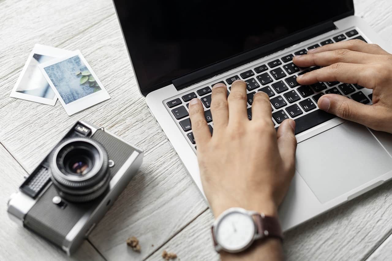 person working at a desk on a laptop