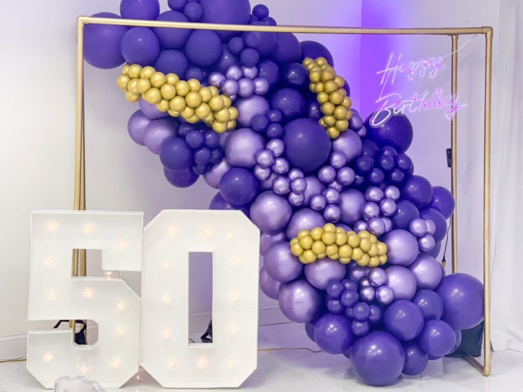 50th birthday sign and balloons