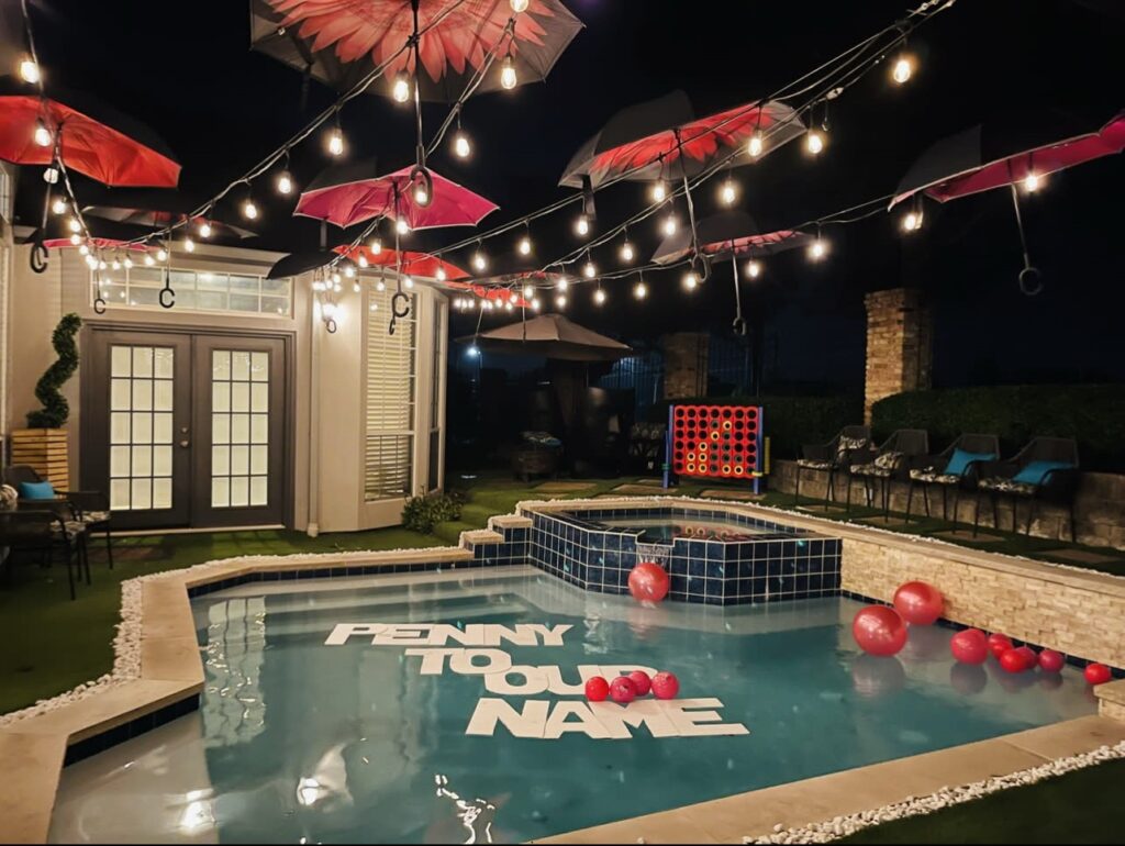 a pool with balloons and a hot tub