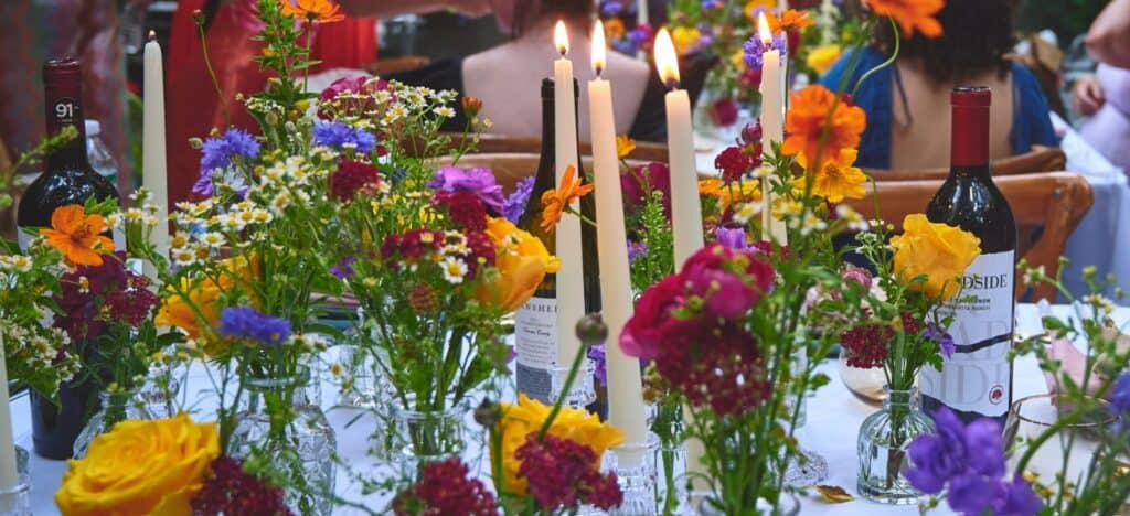 Flower bouquets double as table decor and party favors