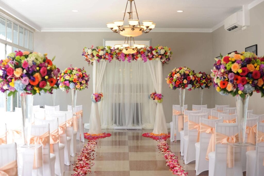 Vibrant floral ceremony arch designed by Indian wedding planners in Indiana