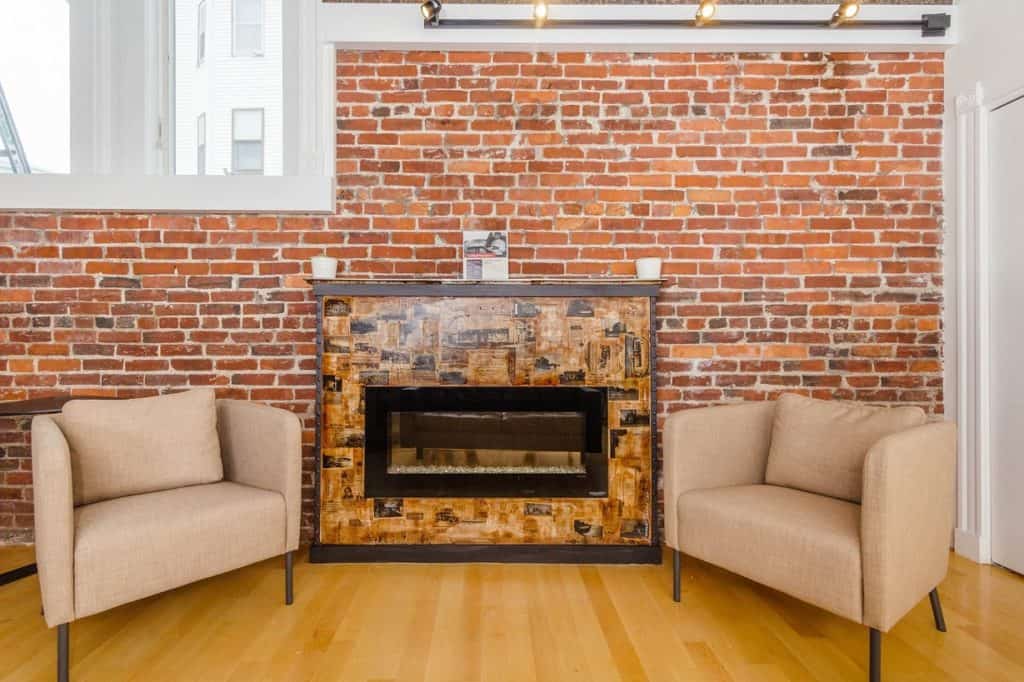 Lounge with Fireplace and Exposed Brick boston rental