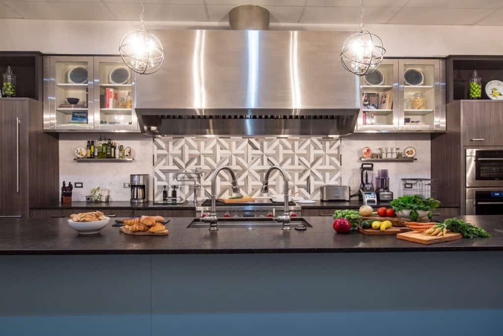 a stainless steel kitchen with food-laden countertop