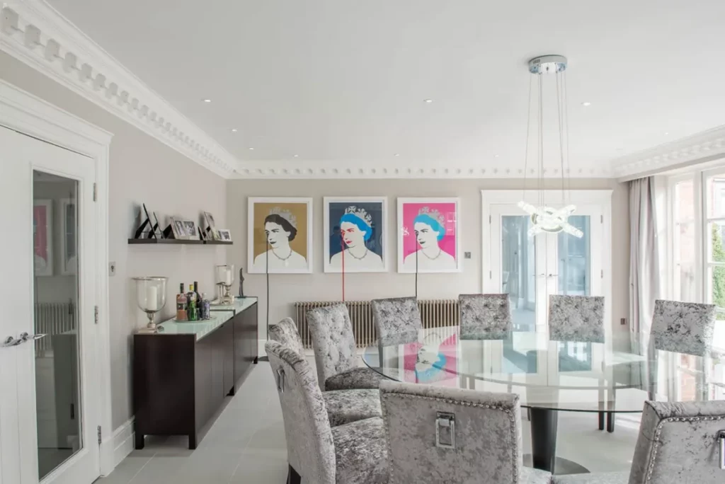 all-white mansion with colorful pop artwork
