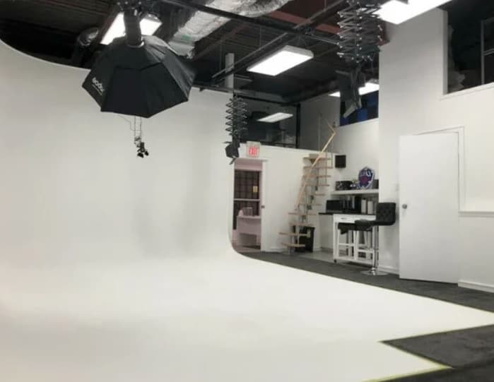 A photo studio with a white cyclorama