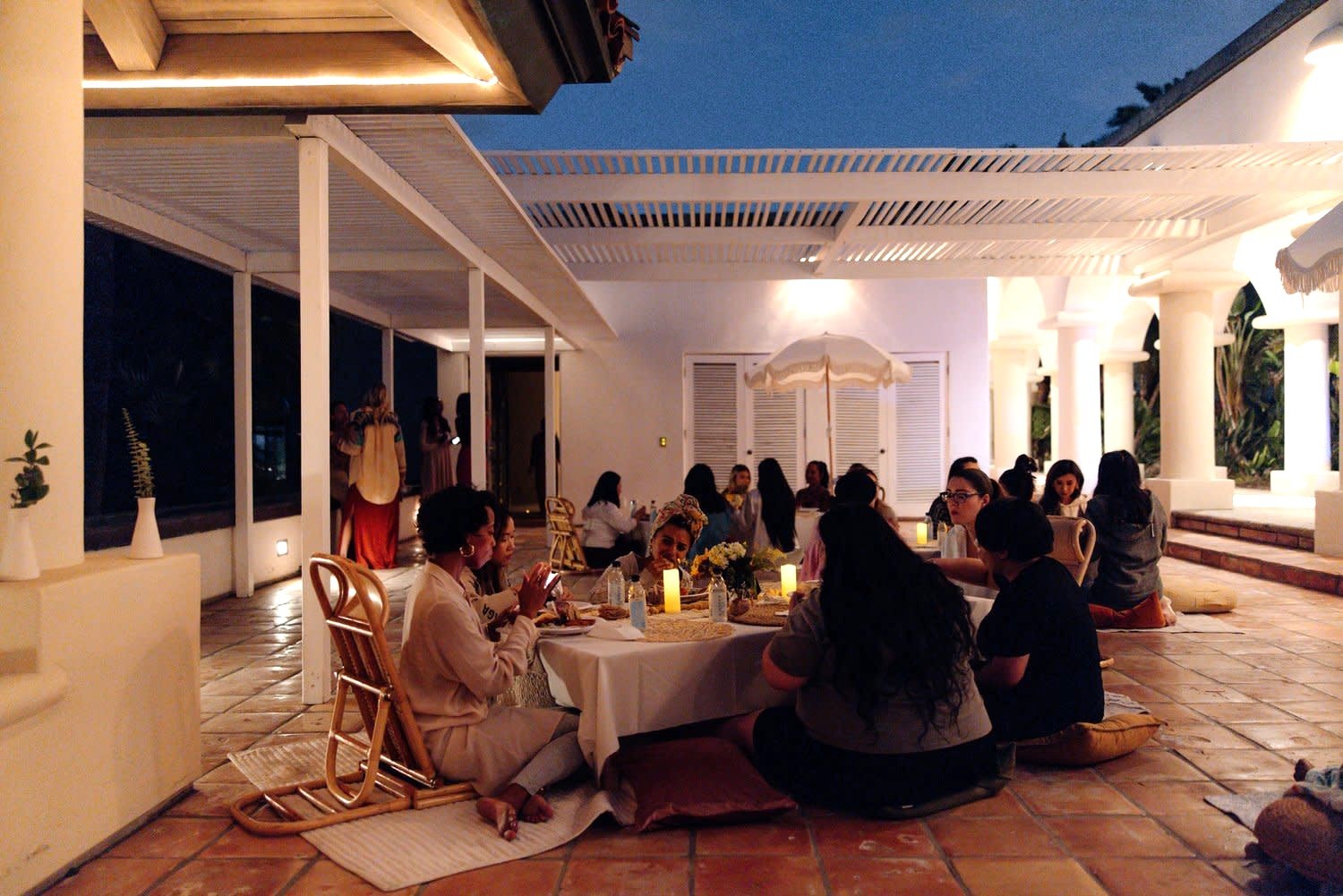 friends dining on an outdoor courtyard space