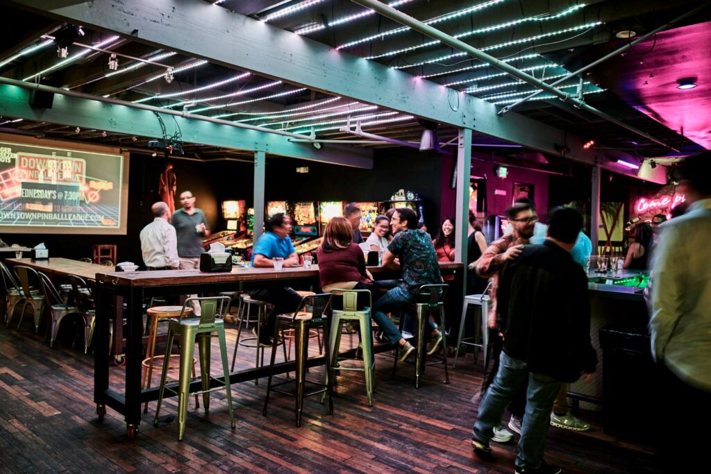 people gathered at a Retro Bar Arcade In Downtown Santa Ana
