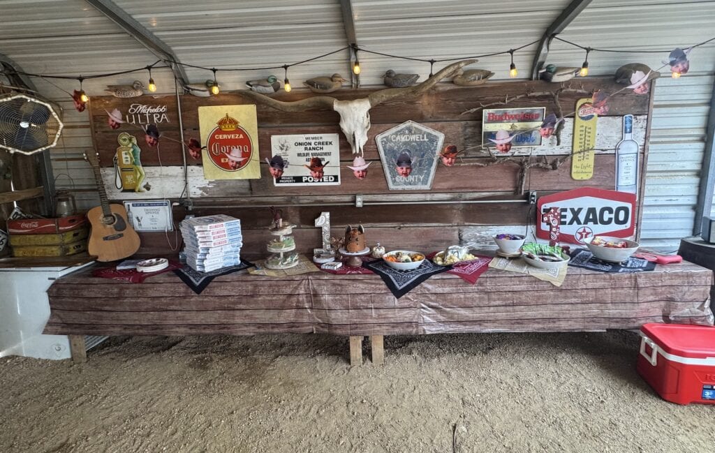 Cowboy party theme for kid with wooden and vintage sign decorations