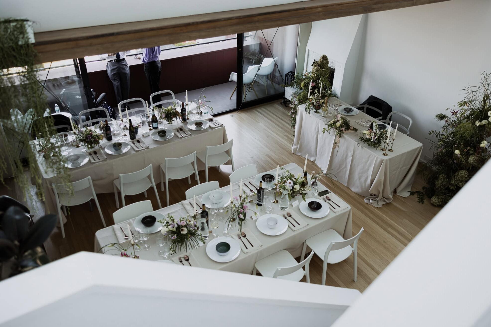 Charlotte wedding located indoors with tables, place settings, florals shot from above