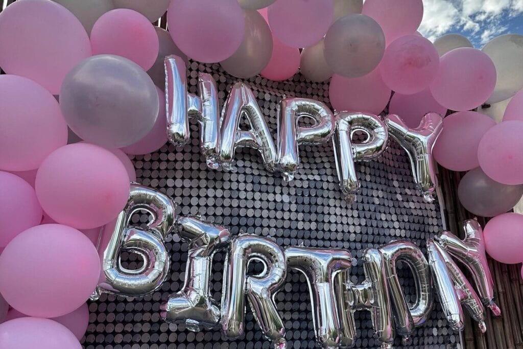 Happy birthday balloons with pink balloon arch for 22nd birthday idea