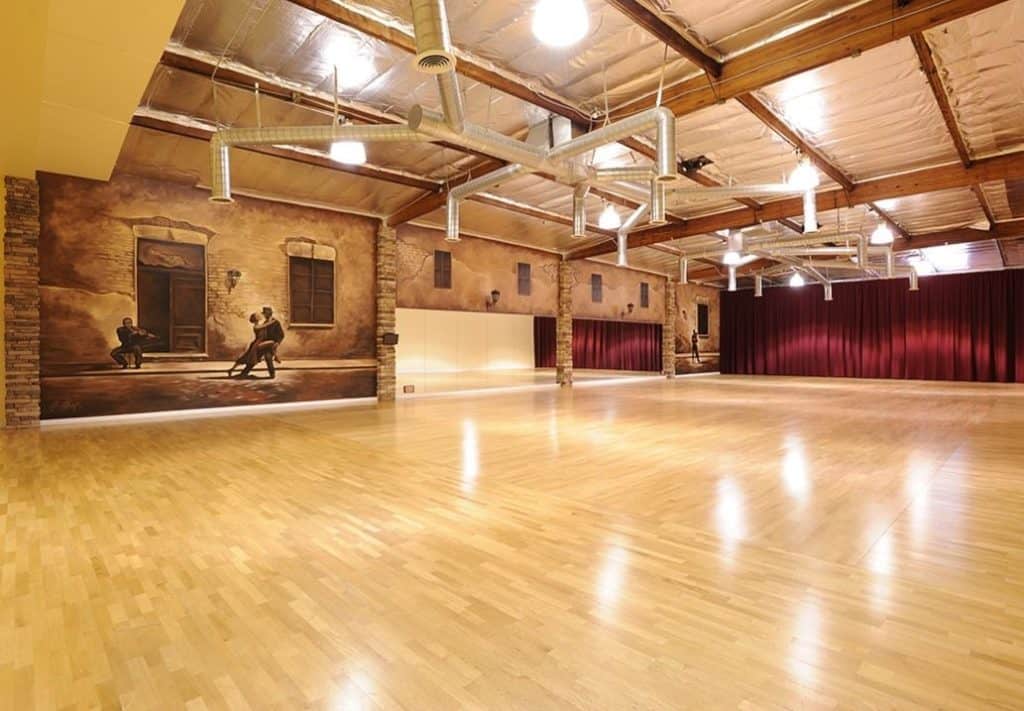 a dance studio with wooden floor