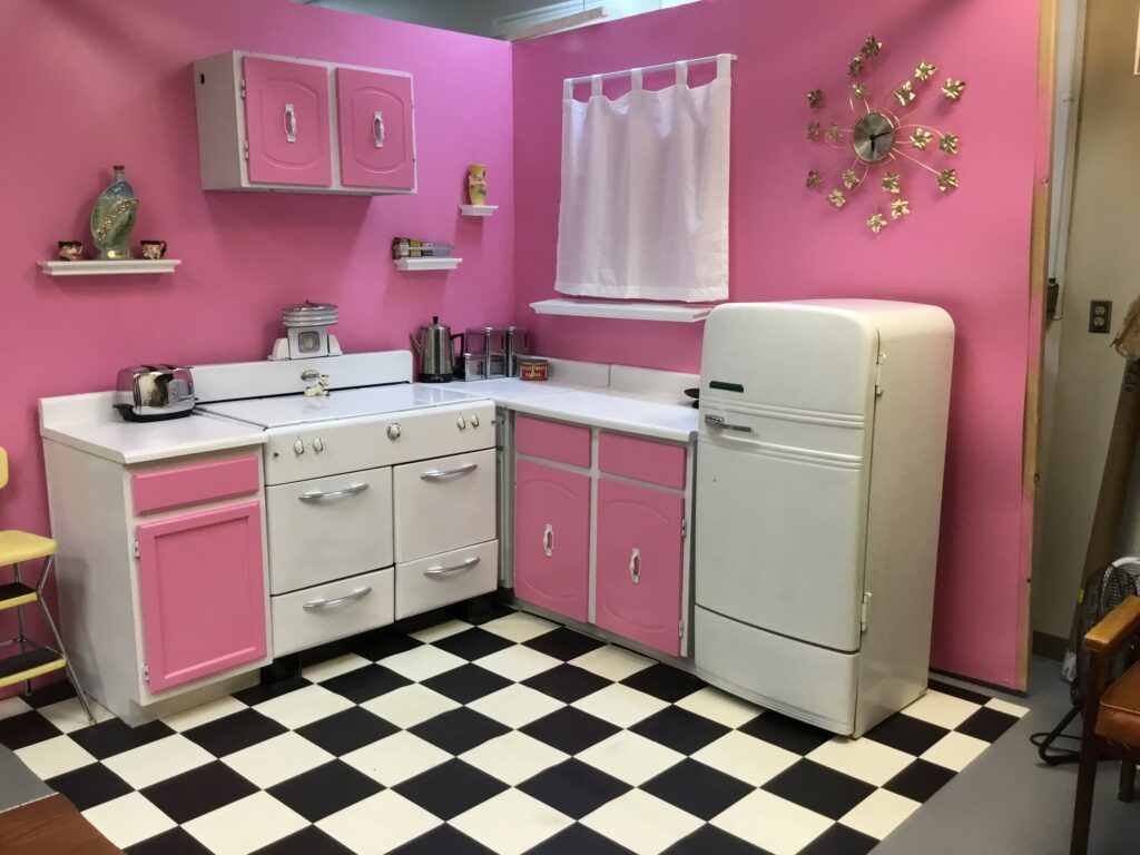 Vintage pink kitchen in Denver with old-fashioned appliances and decor 