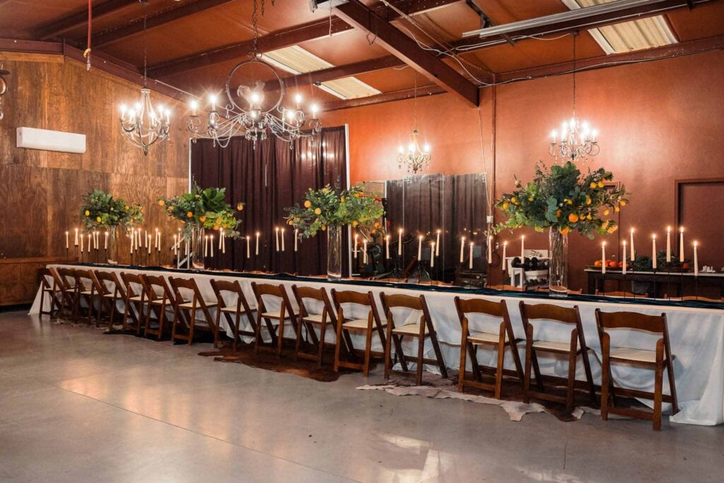Rustic indoor dining table setup for an intimate Arizona wedding reception