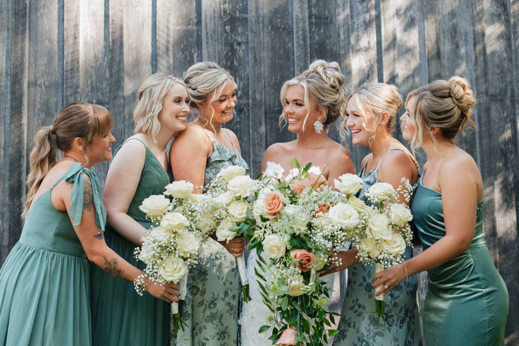 Bride and bridesmaids posing for photos at a Boise wedding