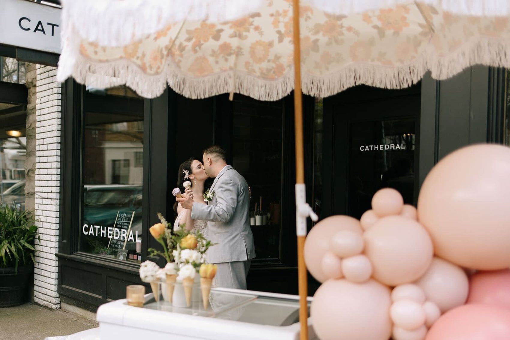 Newlyweds celebrating outside a historic urban venue in downtown Cincinnati