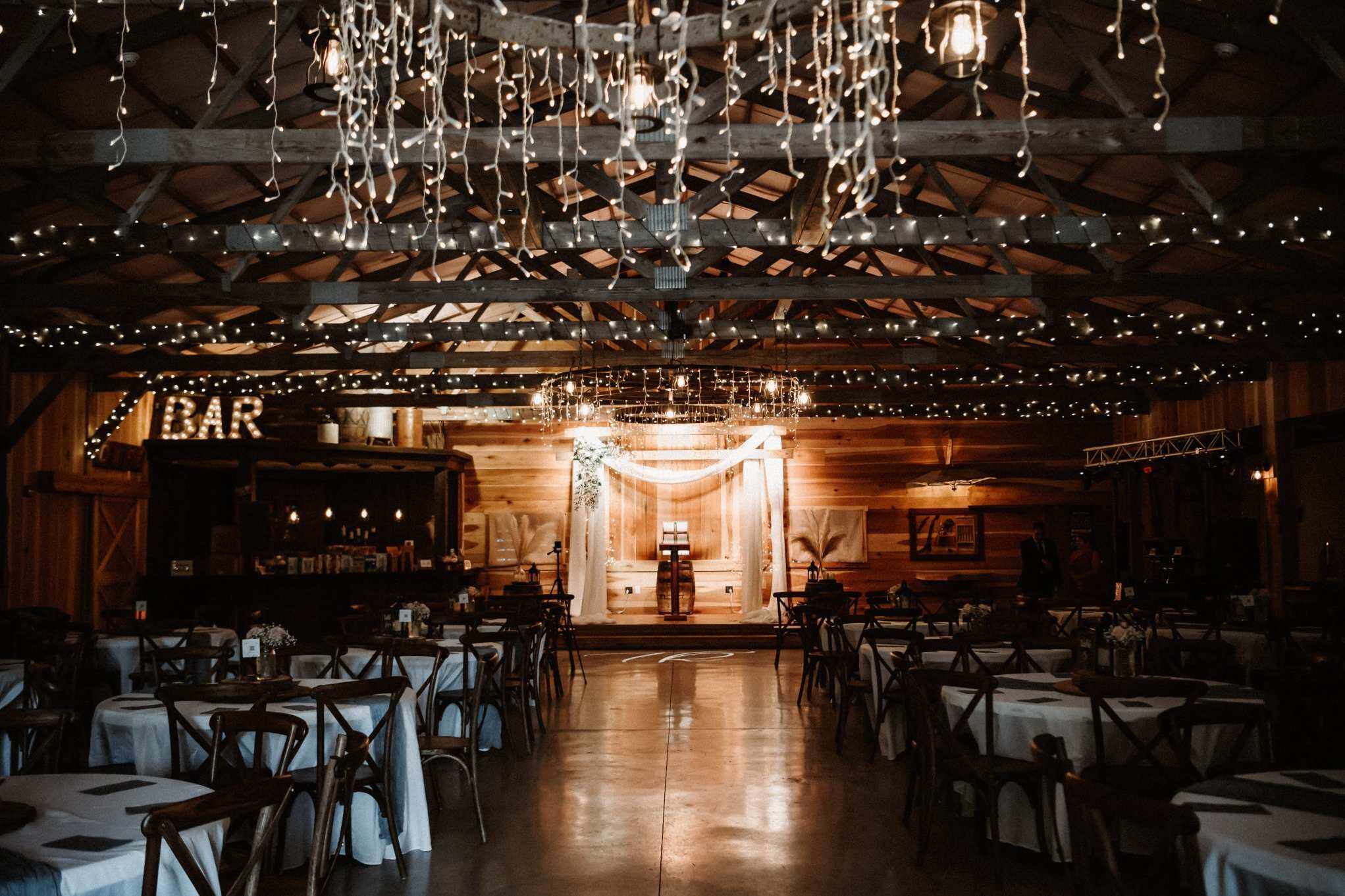Rustic indoor reception venue with warm lighting by Wedding Planners in Lexington