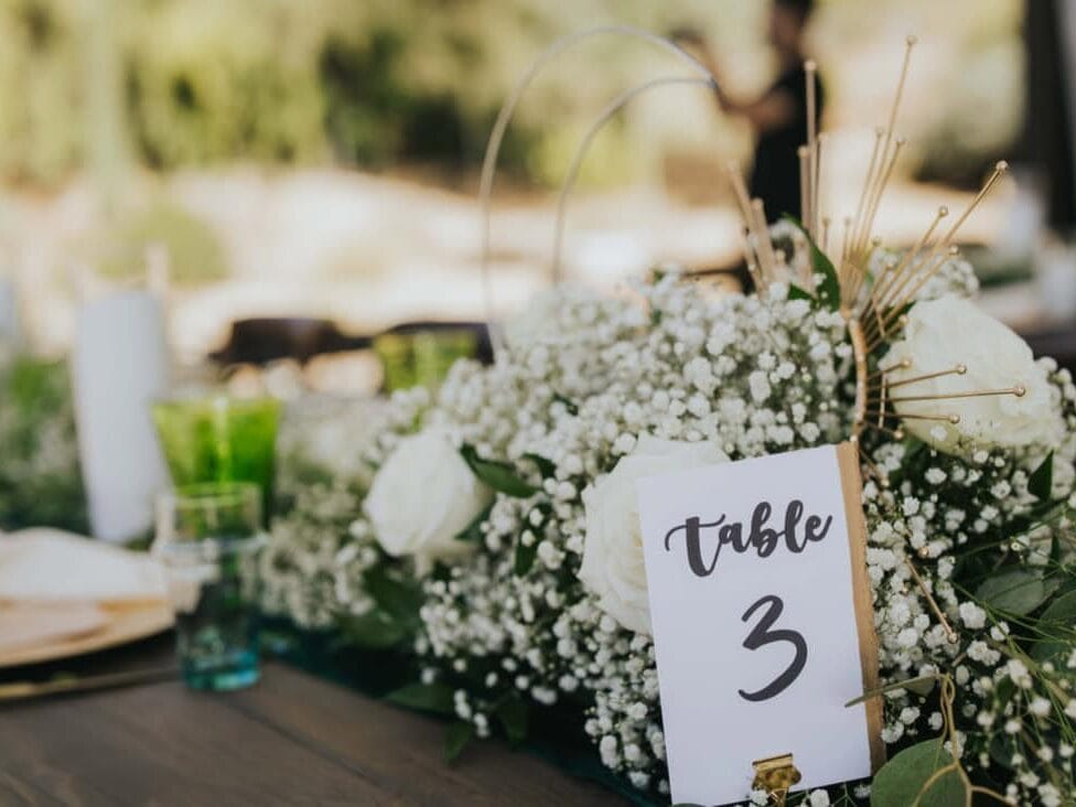 Table placard and florals at New Orleans wedding
