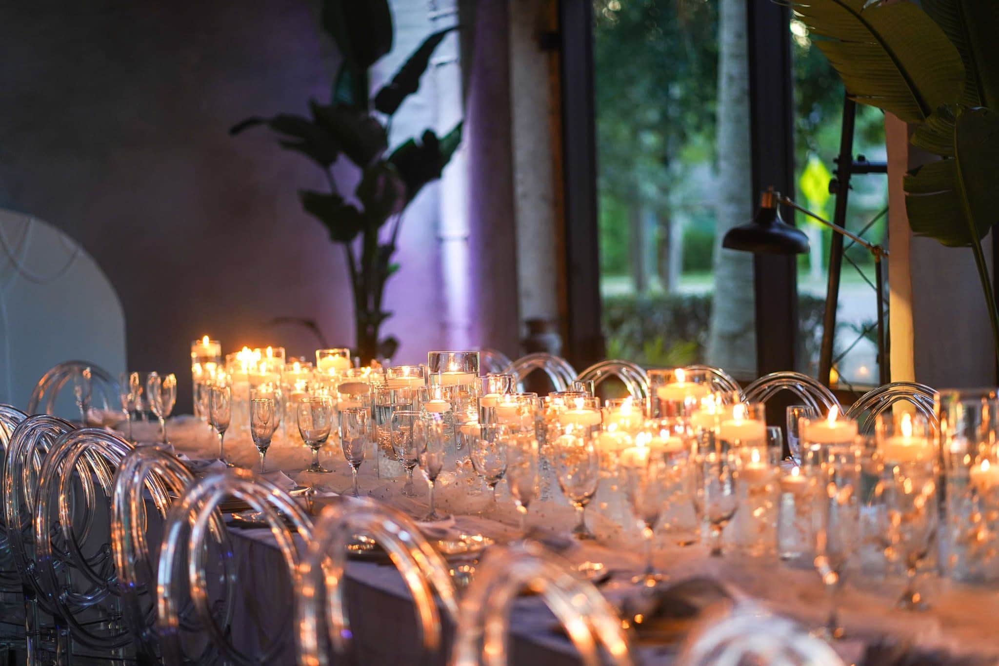 Elegant candlelit table setting for an upscale evening party in Orlando