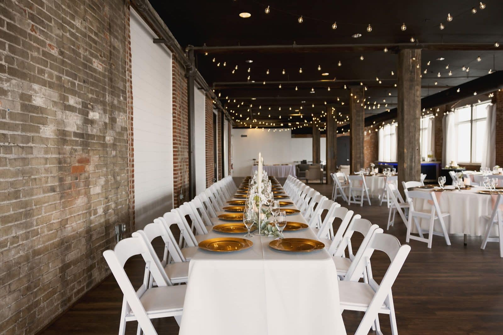 Elegant banquet table setup in an industrial brick Pittsburgh wedding venue