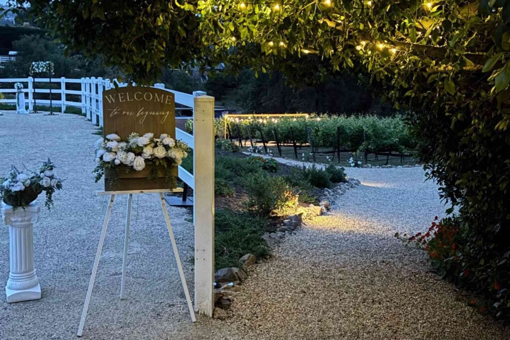Wedding welcome sign with flowers at outdoor venue wedding in San Antonio