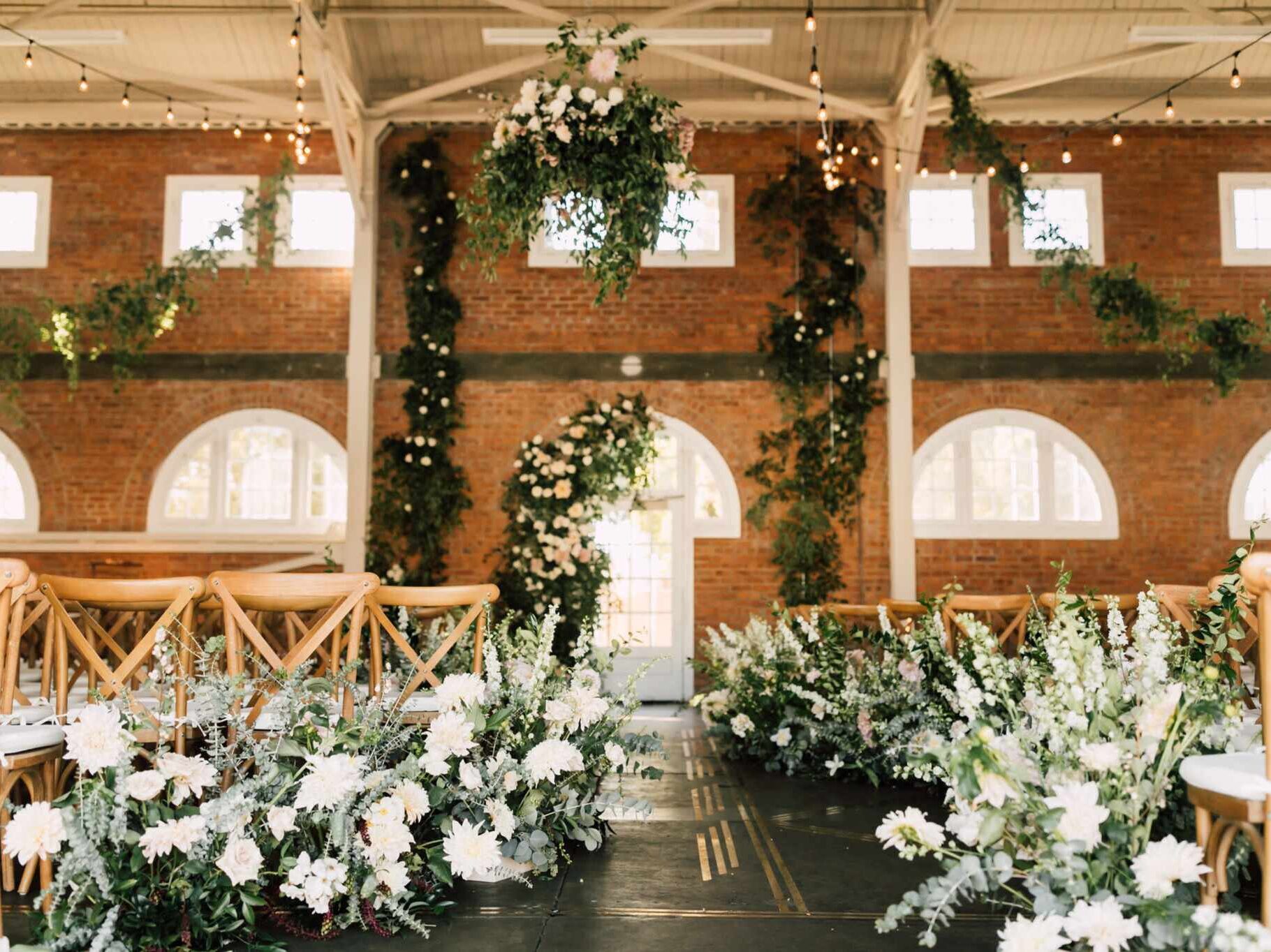 Bright, airy, brick Seattle wedding venue with florals and foliage