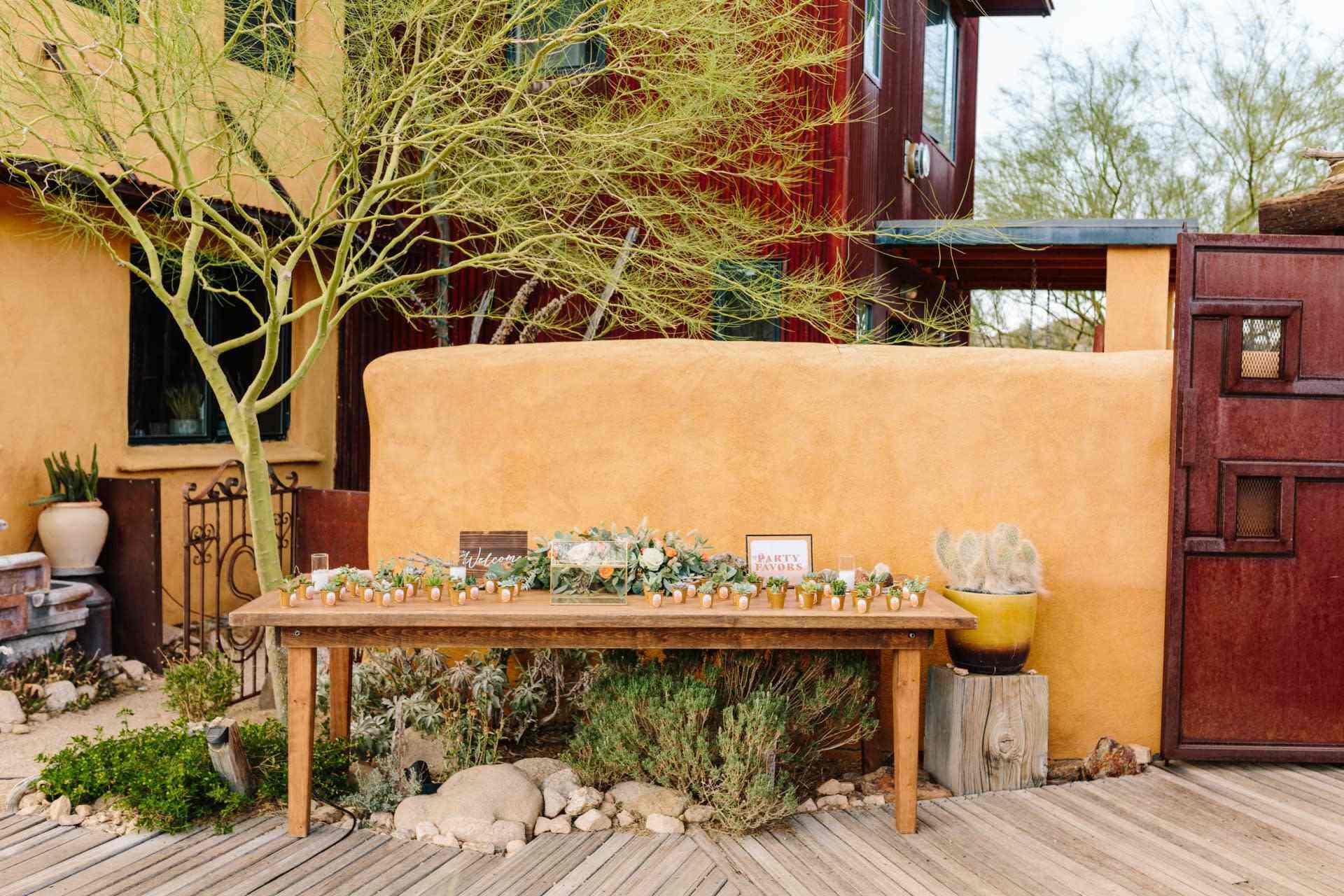 Romantic courtyard wedding setup with candles and florals in Tucson