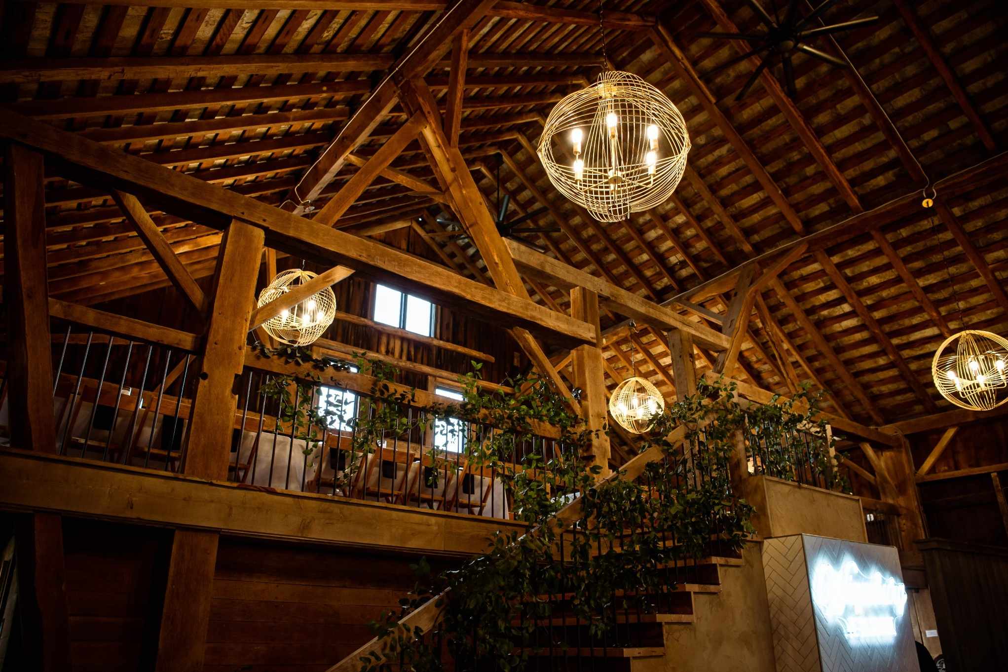 Interior of a rustic Tulsa wedding venue with wooden beams