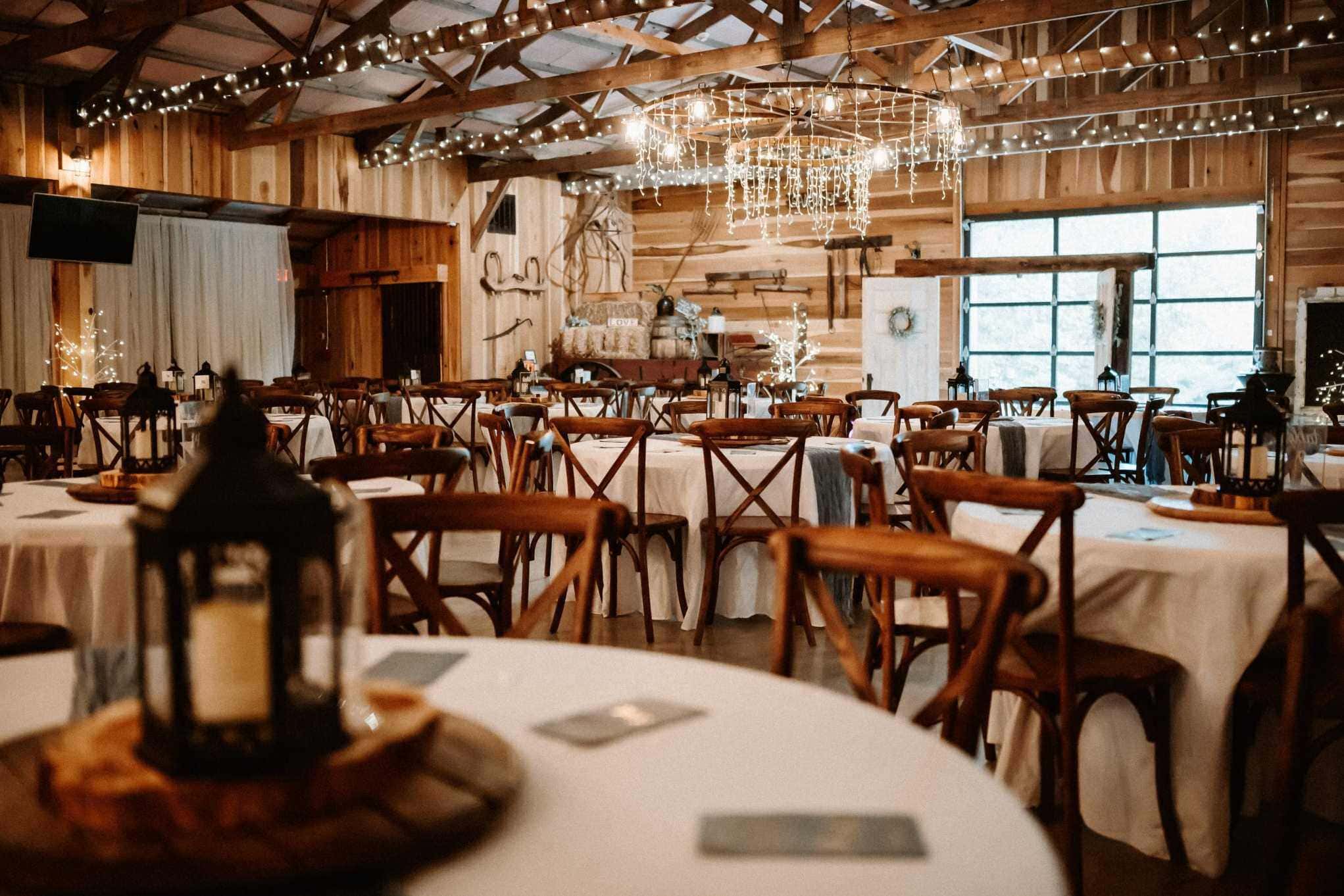 Rustic barn venue with string lights for Vermont wedding planners