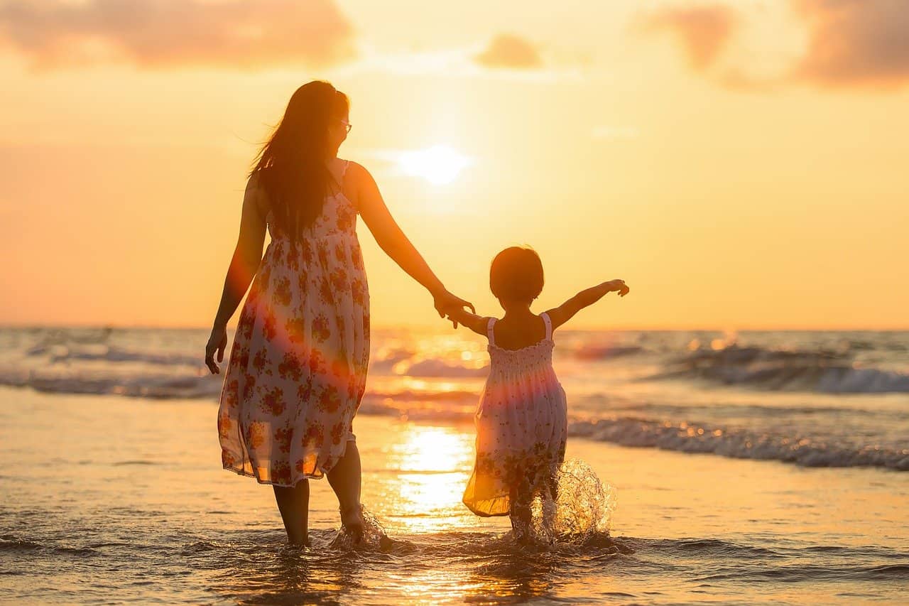 mom and daughter at beach