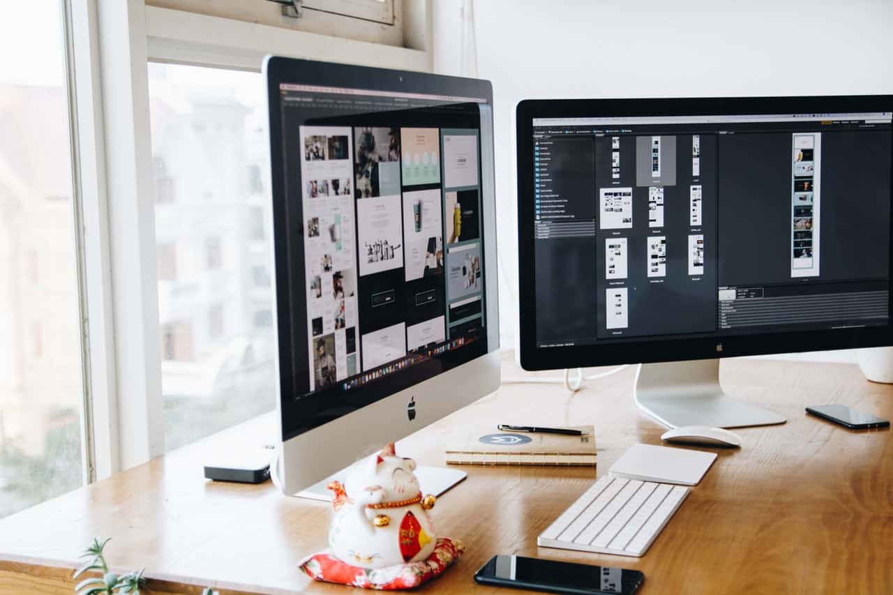 computer monitors on desk