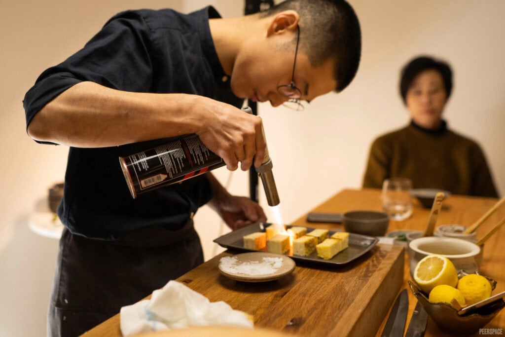 Chef prepares intimate meal for onlookers
