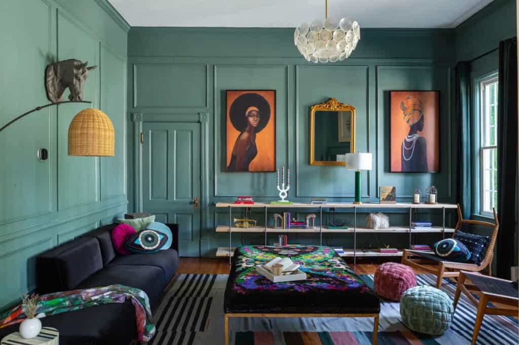 A contemporary living area with framed artwork plus eclectic decor and furniture