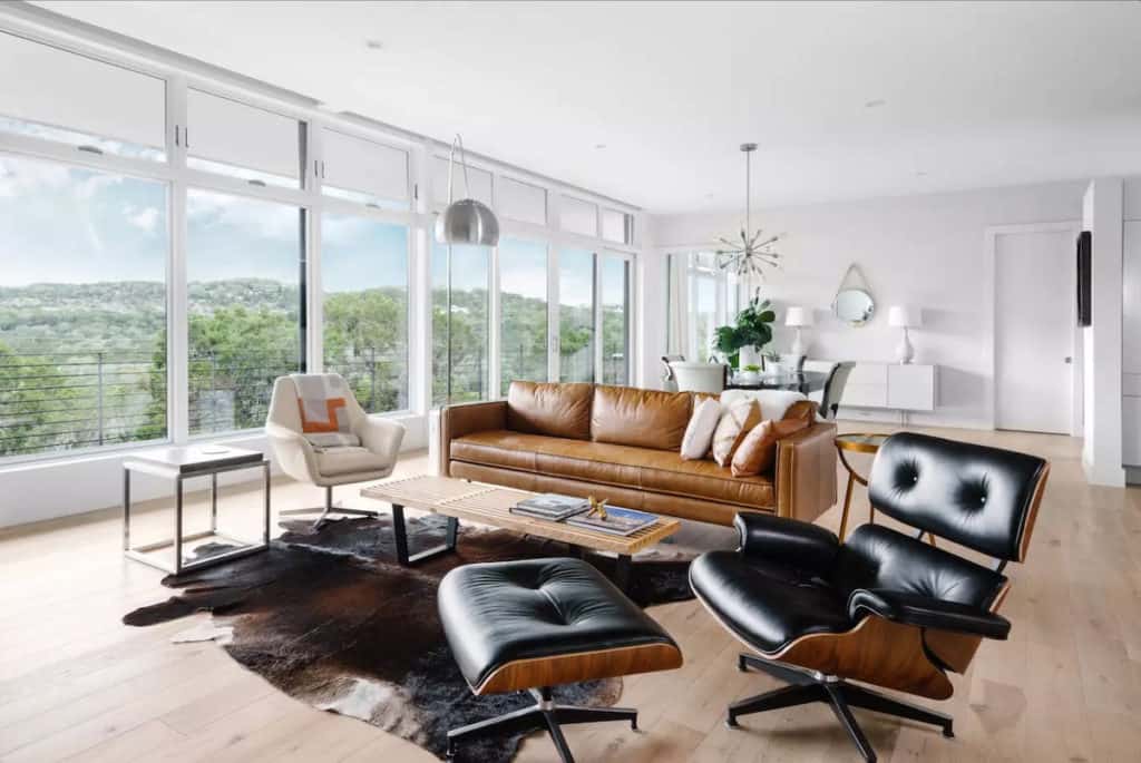 Photo shoot location rental in Austin with Hill Country views, leather furniture and floor to ceiling windows