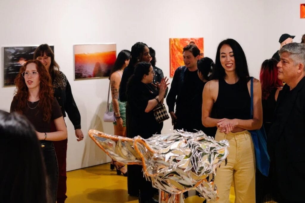 Patrons milling about exhibits at Bakehouse Art Complex in Miami