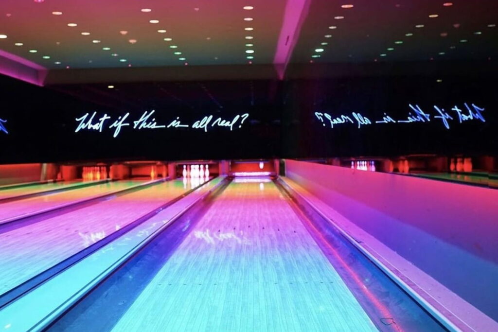 Neon lights illuminate a bowling alley in Miami