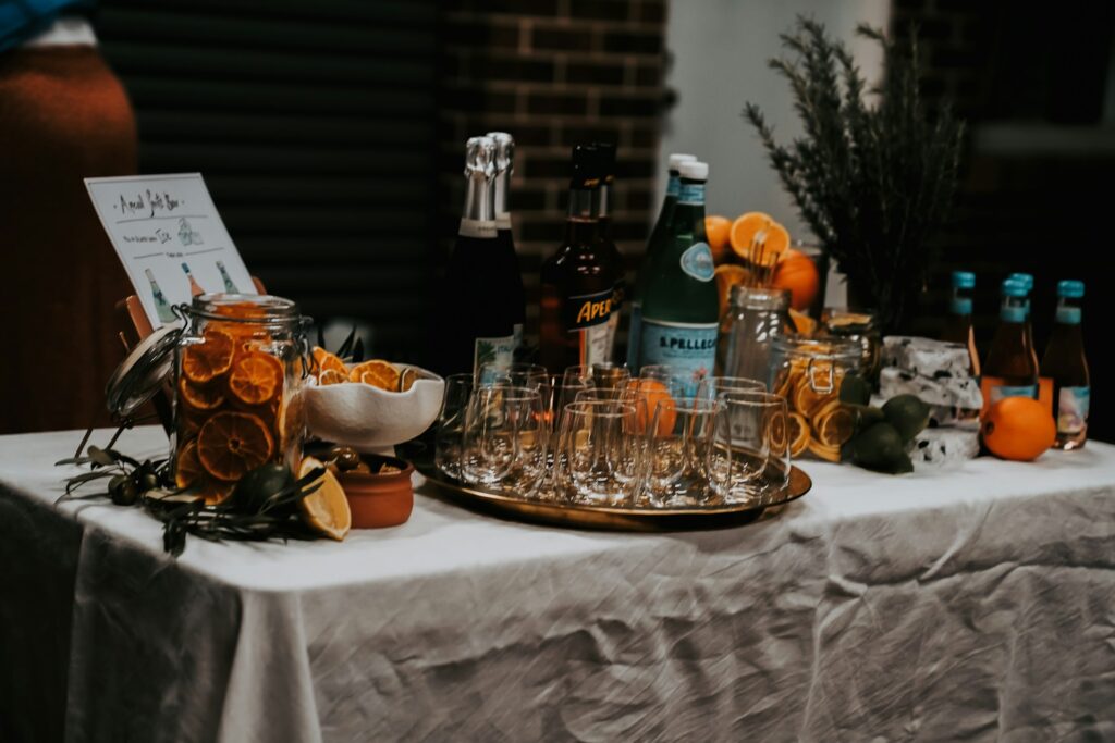 DIY small wedding reception cocktail bar with aperol spritz ingredients