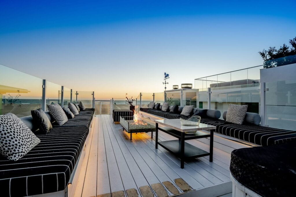 Beachside rooftop patio at sunset