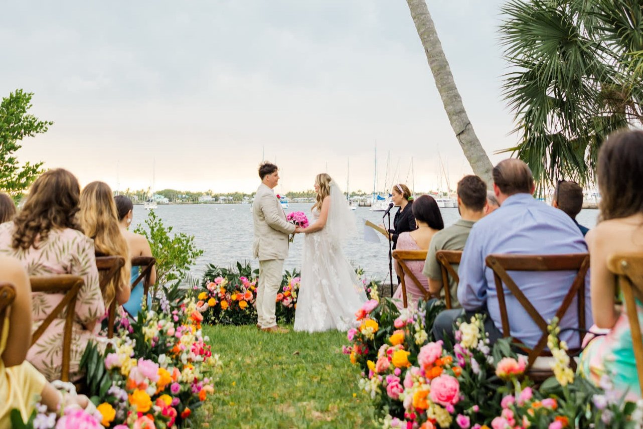 Waterfront wedding ceremony on lawn with marina views in Long Beach