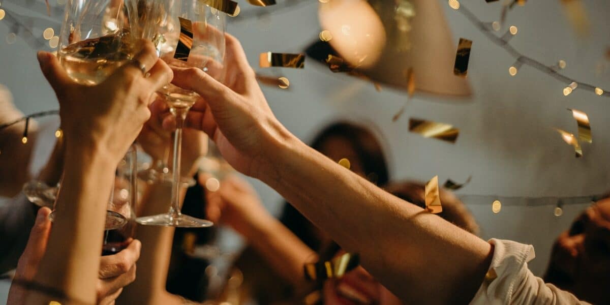 people cheering with glasses