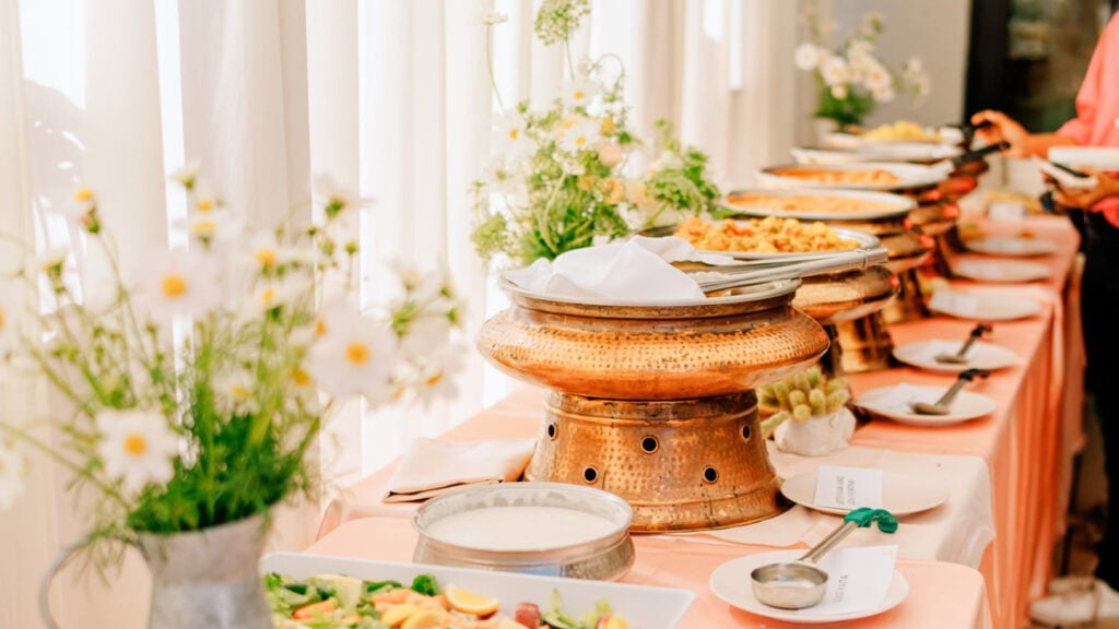 food lining a buffet table at a birthday party