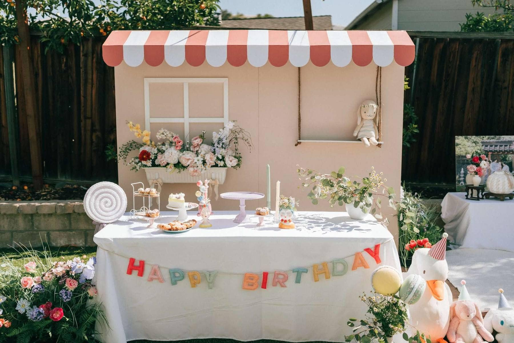 Themed backyard birthday party display with Happy Birthday banner in Houston