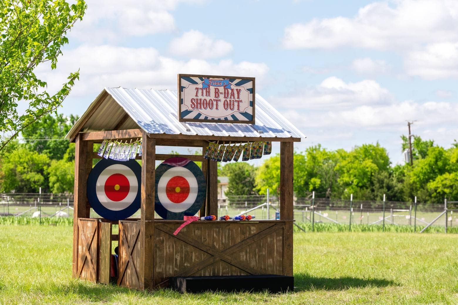 Rustic carnival game booth for Houston birthday party entertainment