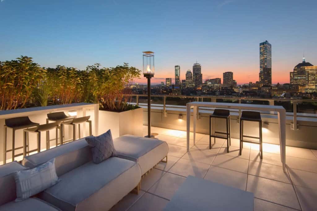 A rooftop lounge with a scenic cityscape view in Boston