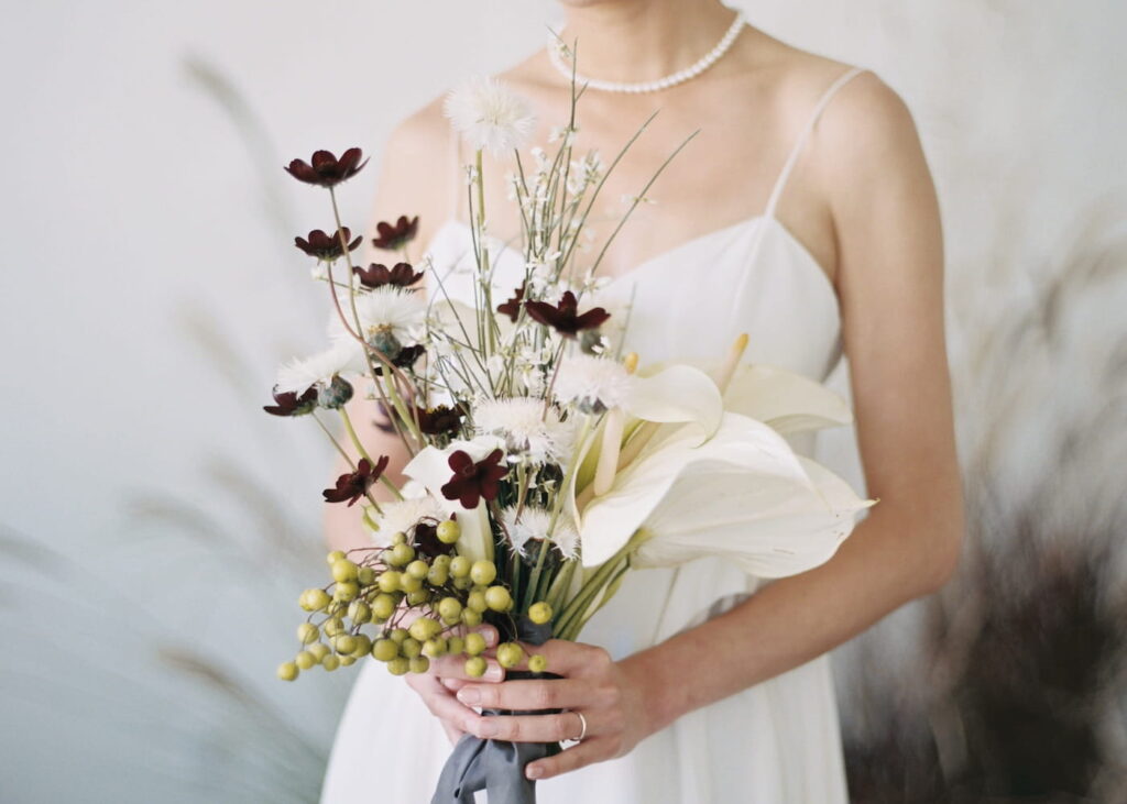 Close up of a unique wedding bouquet with a bohemian flair