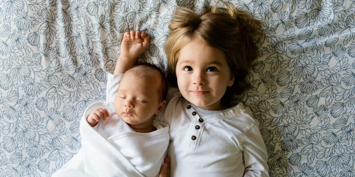 newborn and sibling