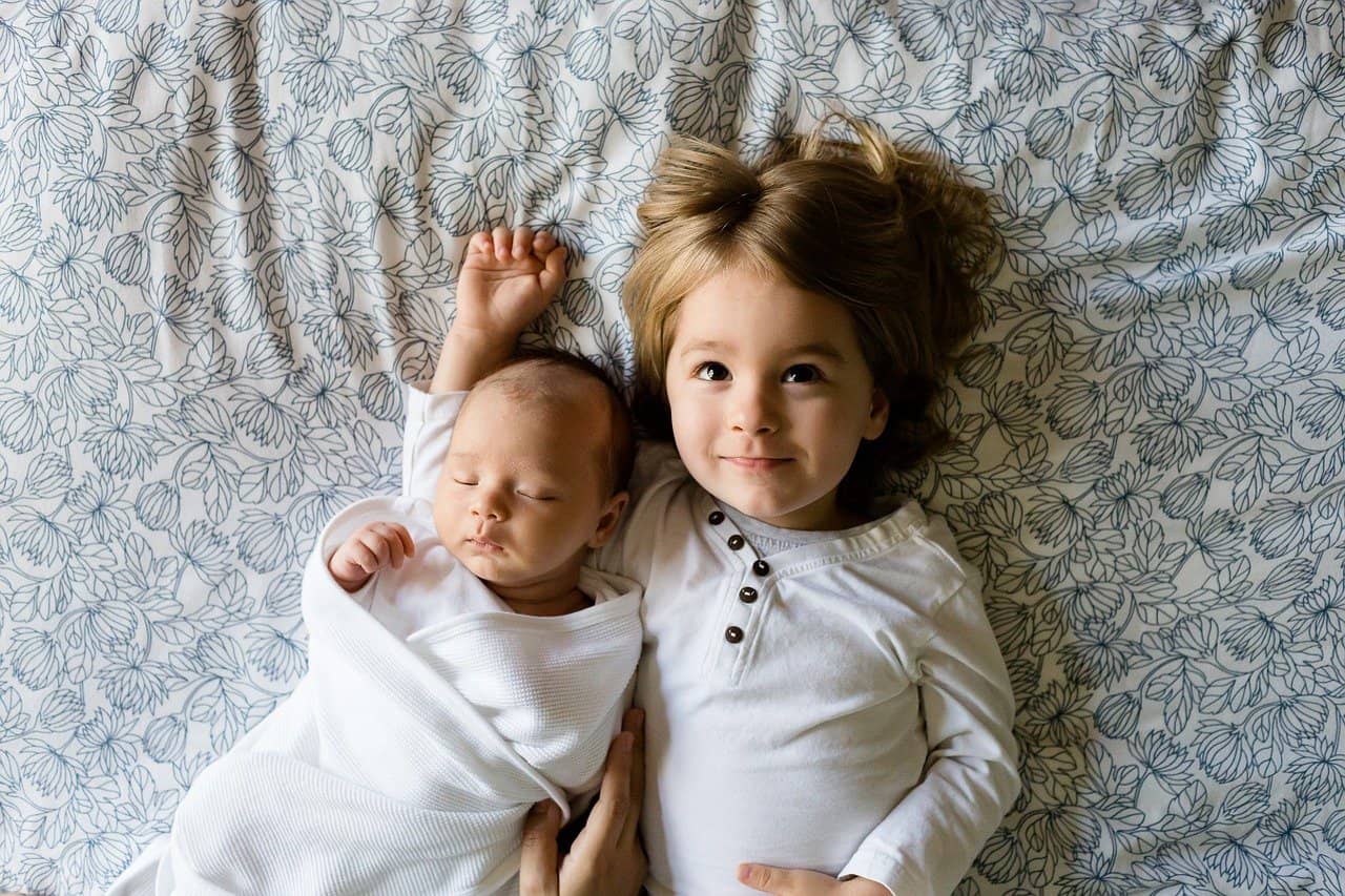 newborn and sibling