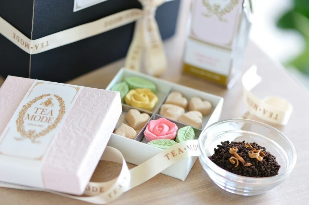 Box with tea sweets and loose leaf as Galentines gift basket idea