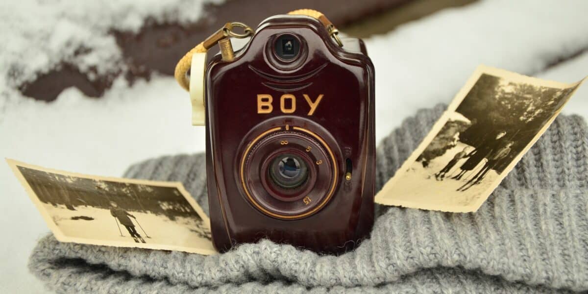 old camera with photographs