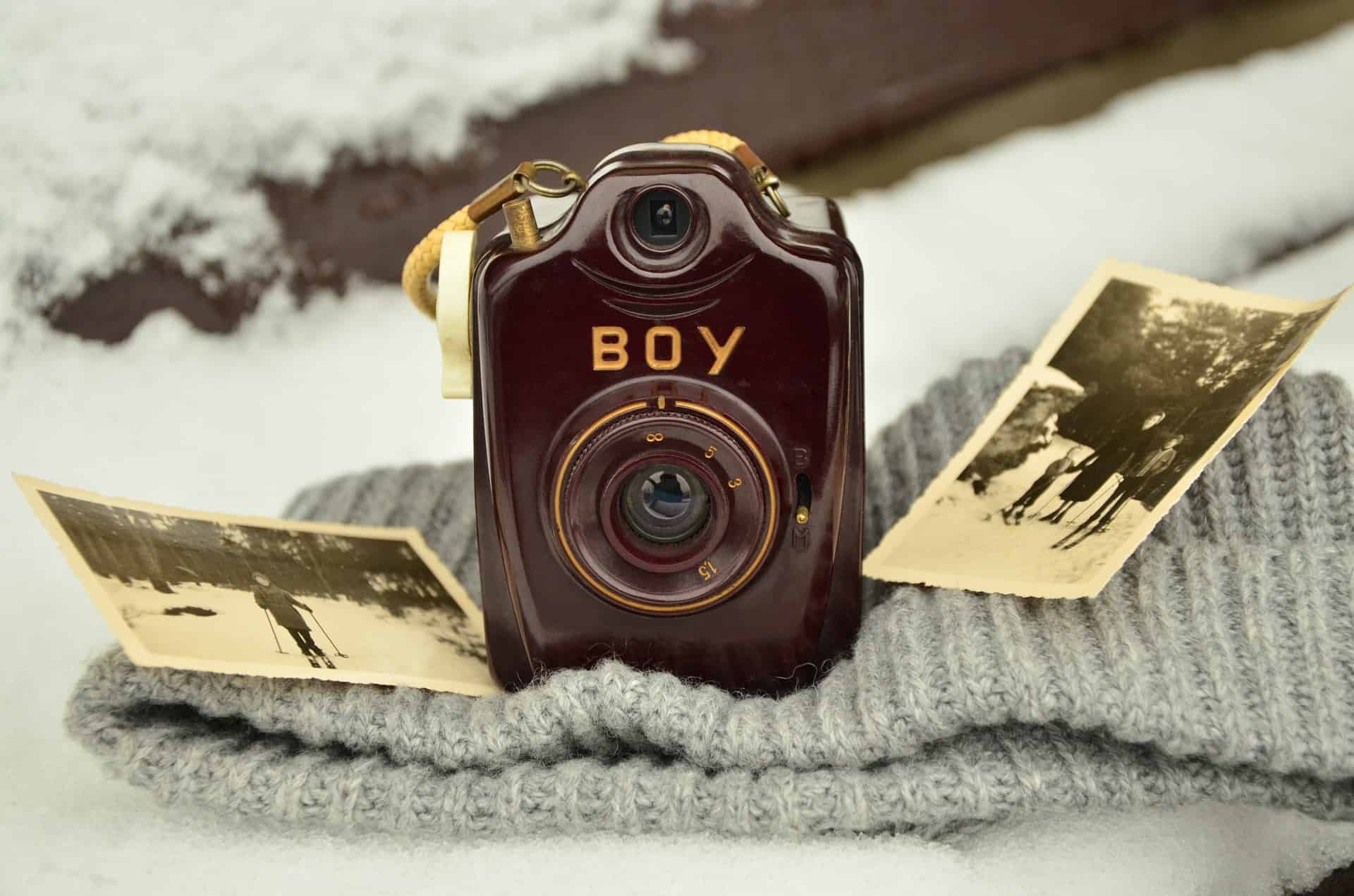 old camera with photographs